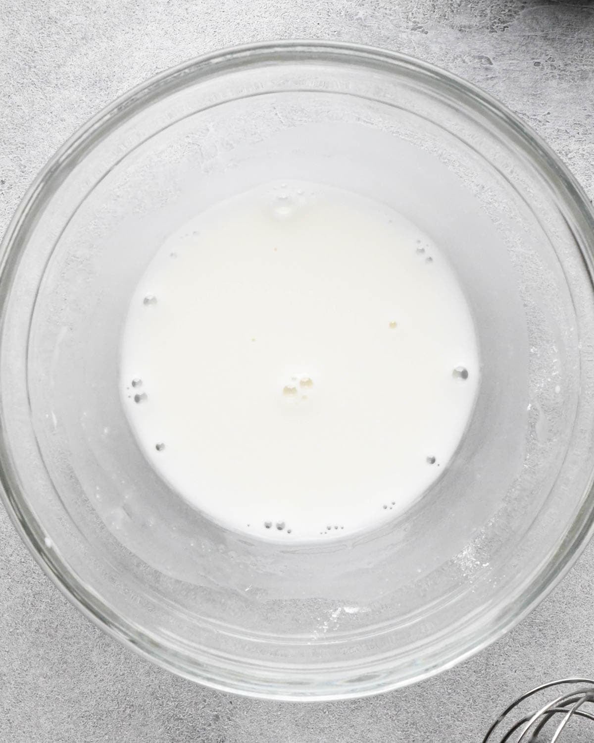 making teriyaki sauce for teriyaki meatballs - cornstarch and water in a small glass bowl after mixing