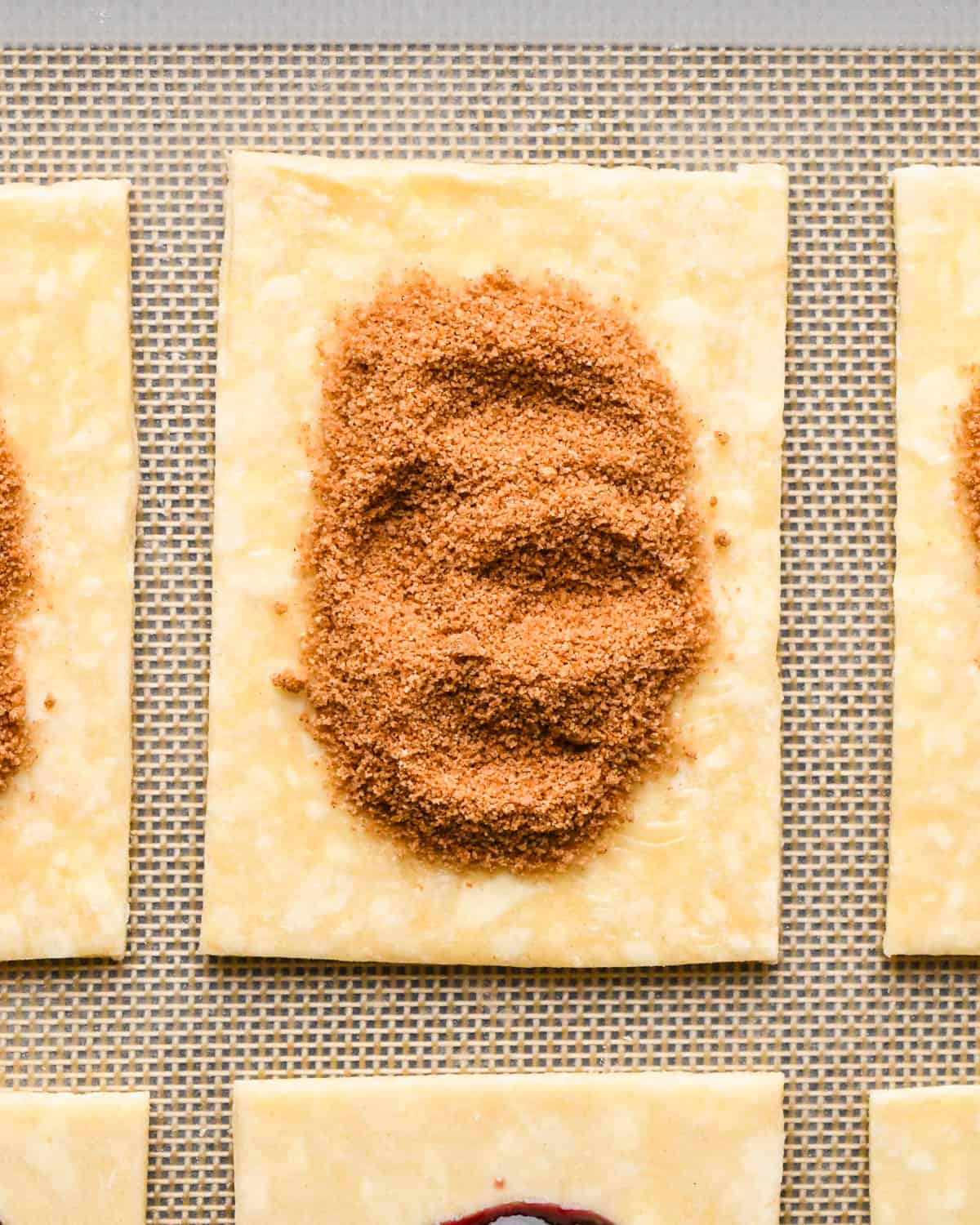 making homemade pop tarts - brown sugar cinnamon filling added to a rectangle of pastry dough