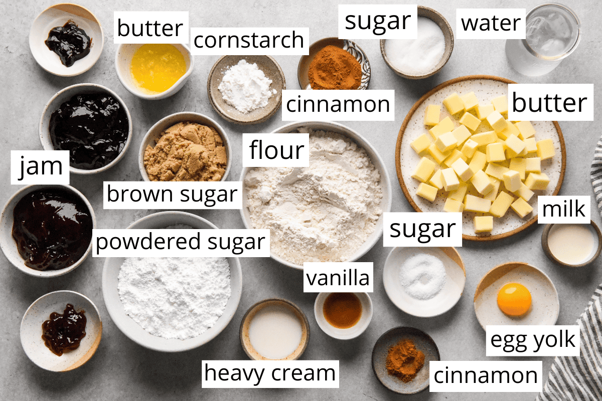 overhead photo of the ingredients in this homemade pop tarts recipe all in bowls and labeled like butter, flour, powdered sugar, jam, etc.
