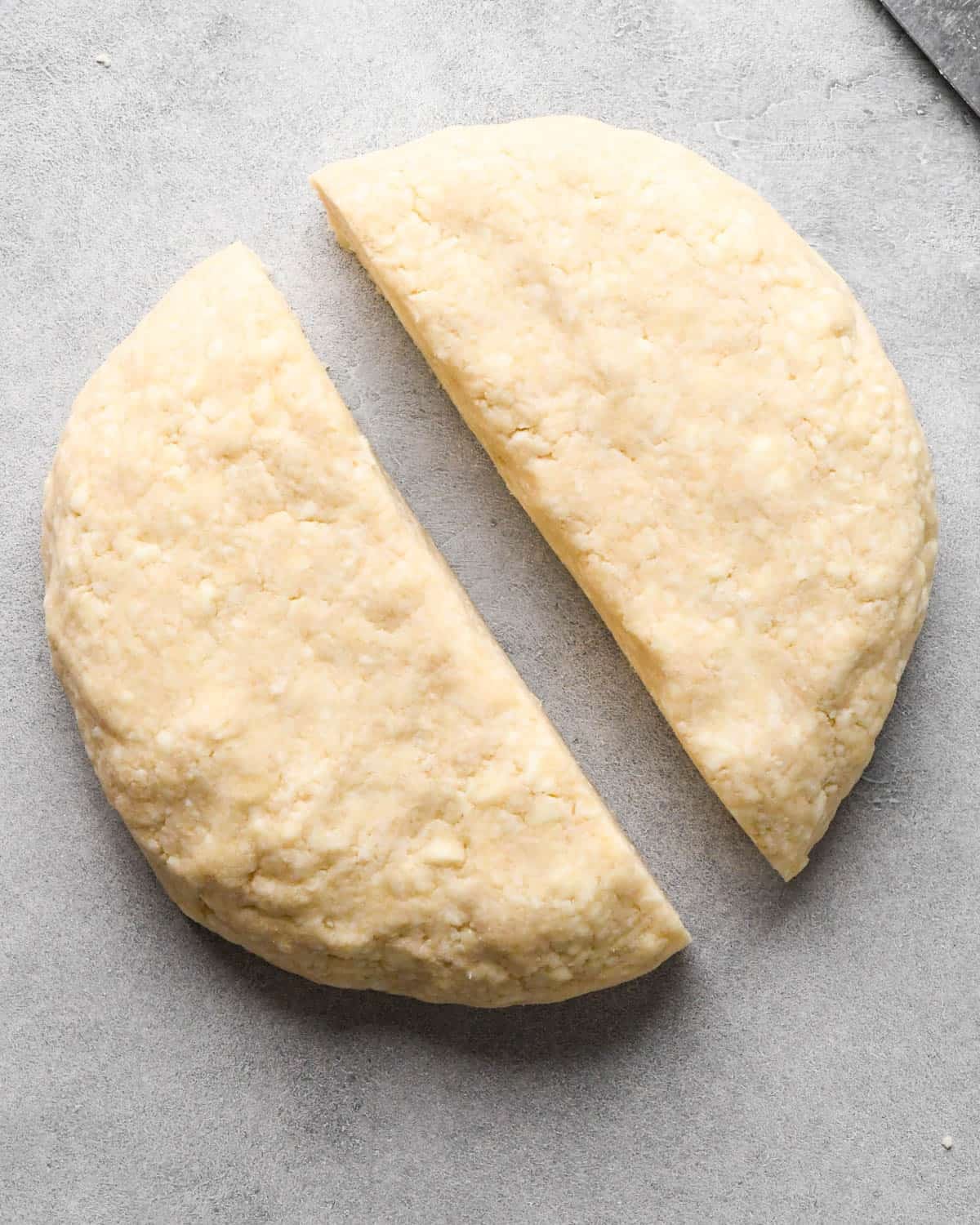 making homemade pop tarts - dough formed into a round disc that has been cut in half