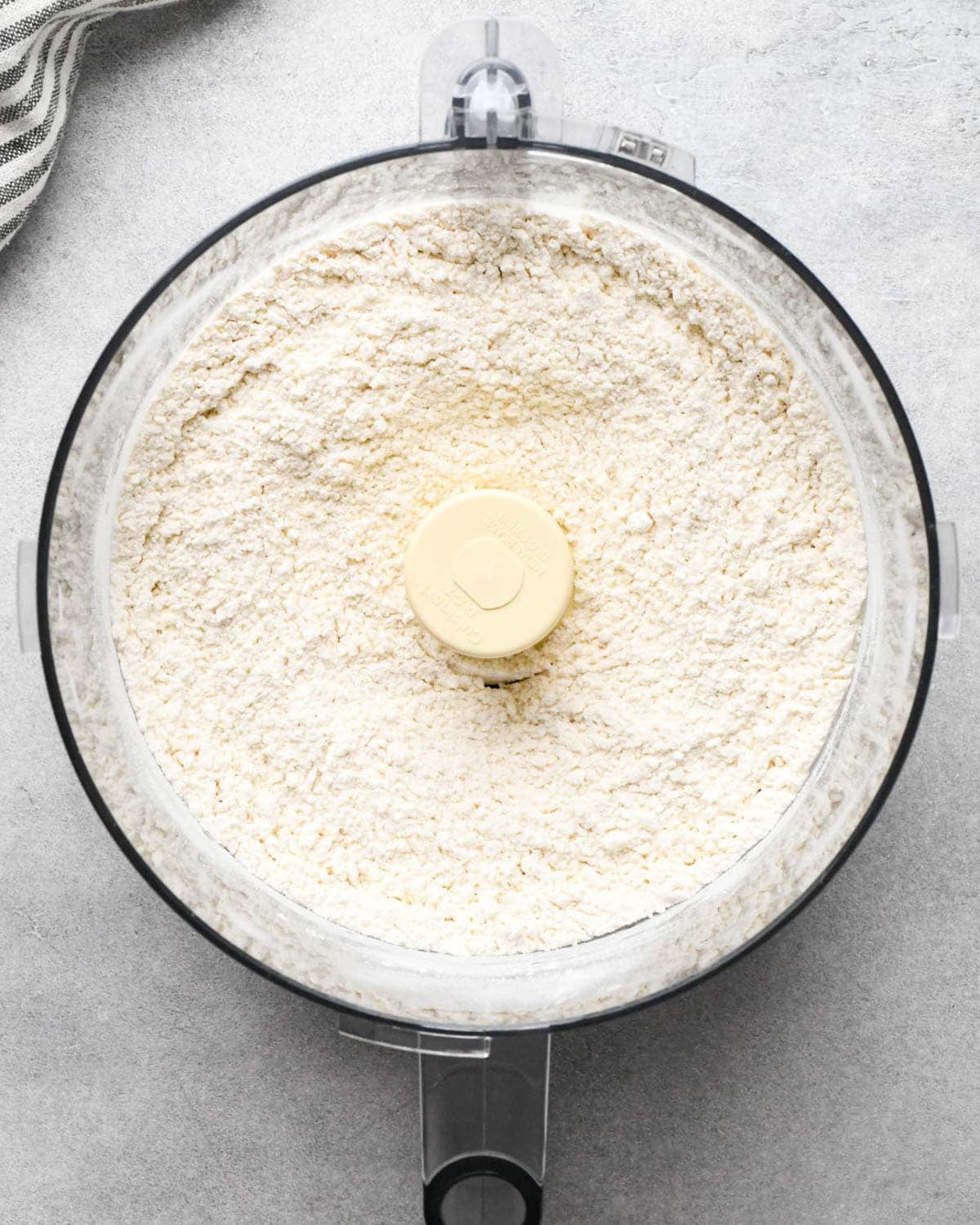 making apple hand pies crust - flour mixture in a food processor fitted with the S blade