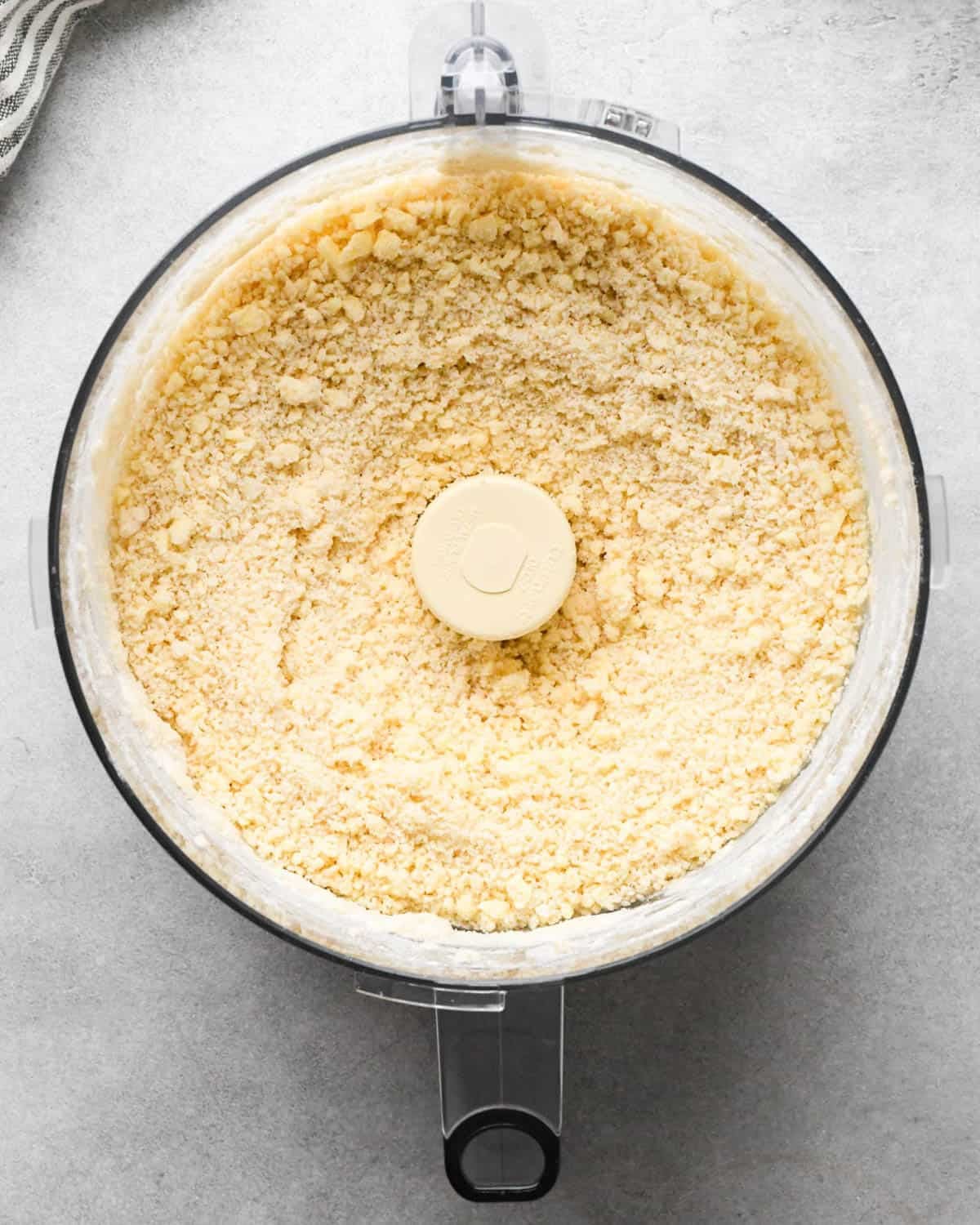 making apple hand pies crust - dough in a food processor after processing