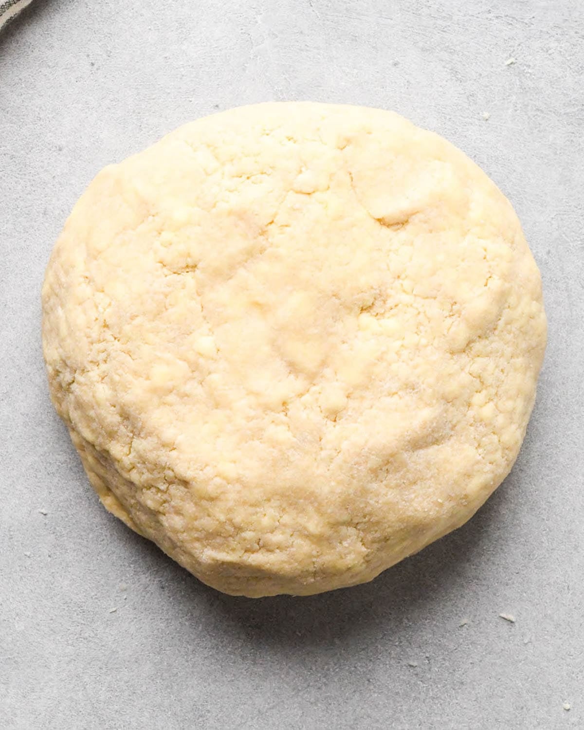 making apple hand pies crust - dough formed into a round disc