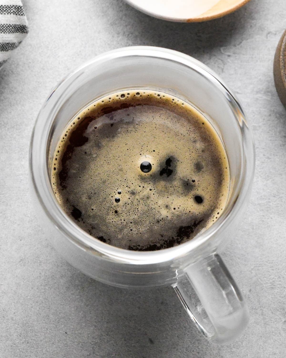 how to make a vanilla latte - overhead view of the espresso in the glass mug