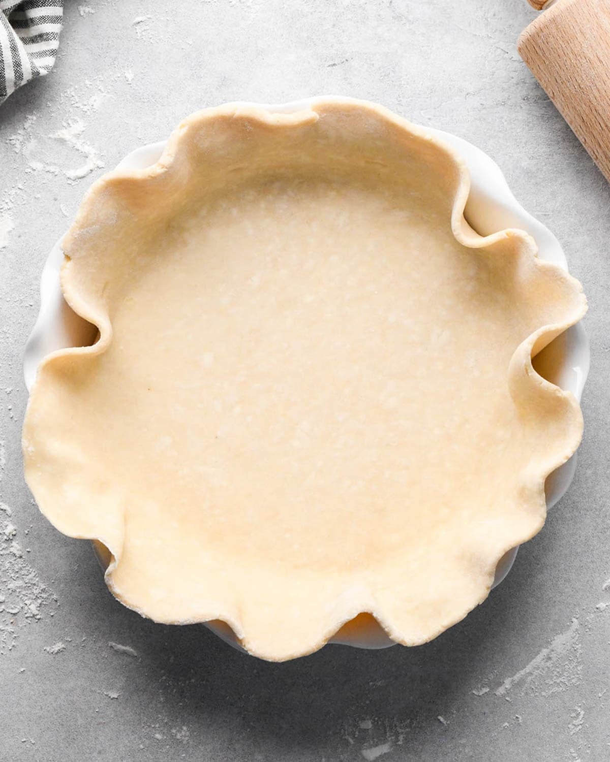 making apple cranberry pie crust - bottom crust in a pie plate