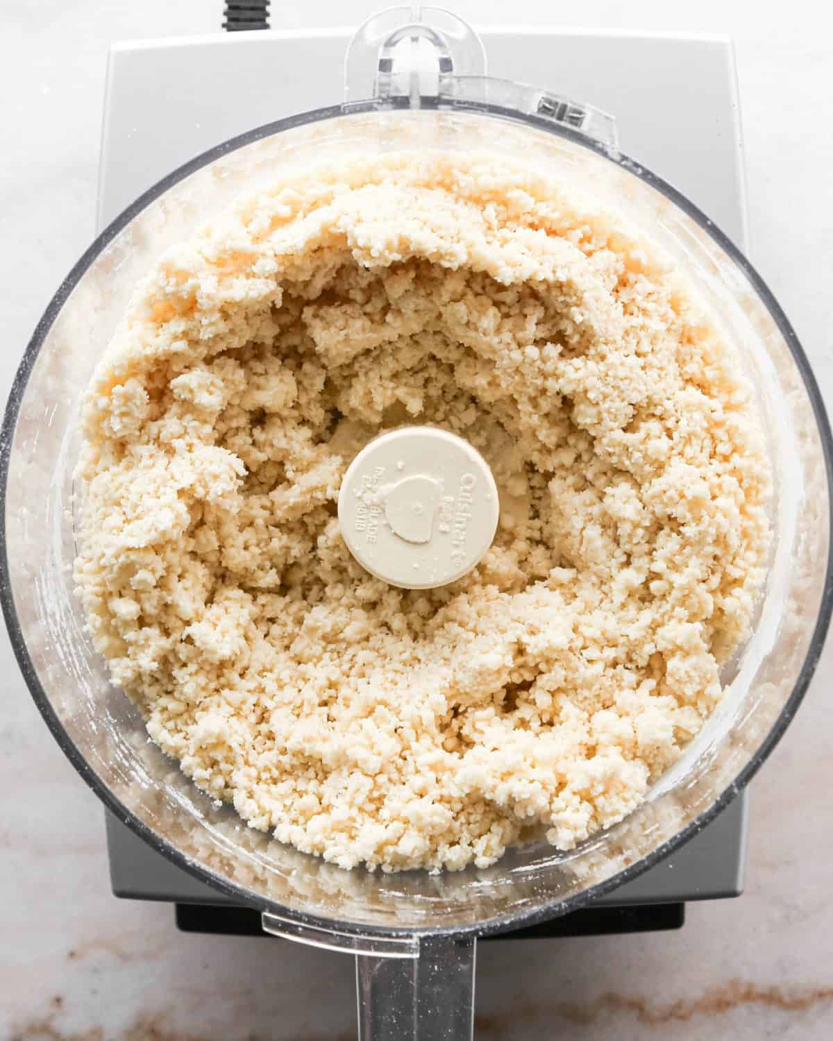 how to make pecan pie without corn syrup - pie crust mixture after being processed in a food processor fitted with the "S" blade.