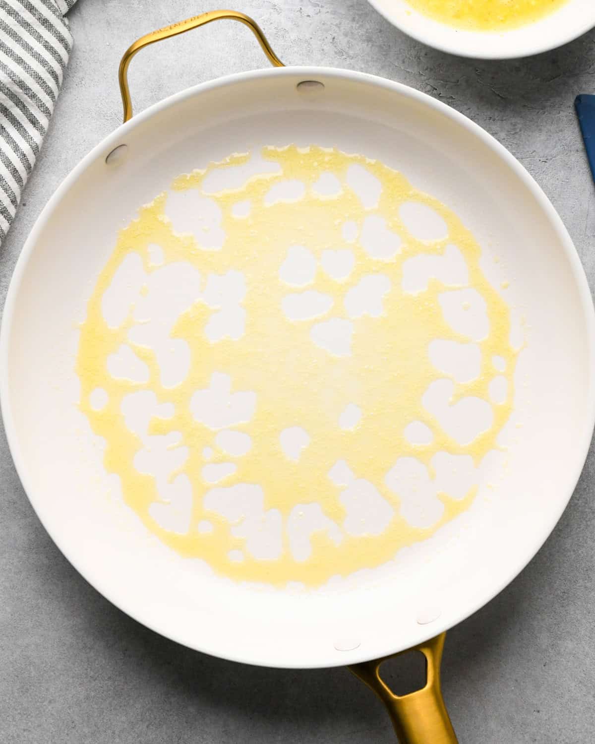 melted butter in a white skillet